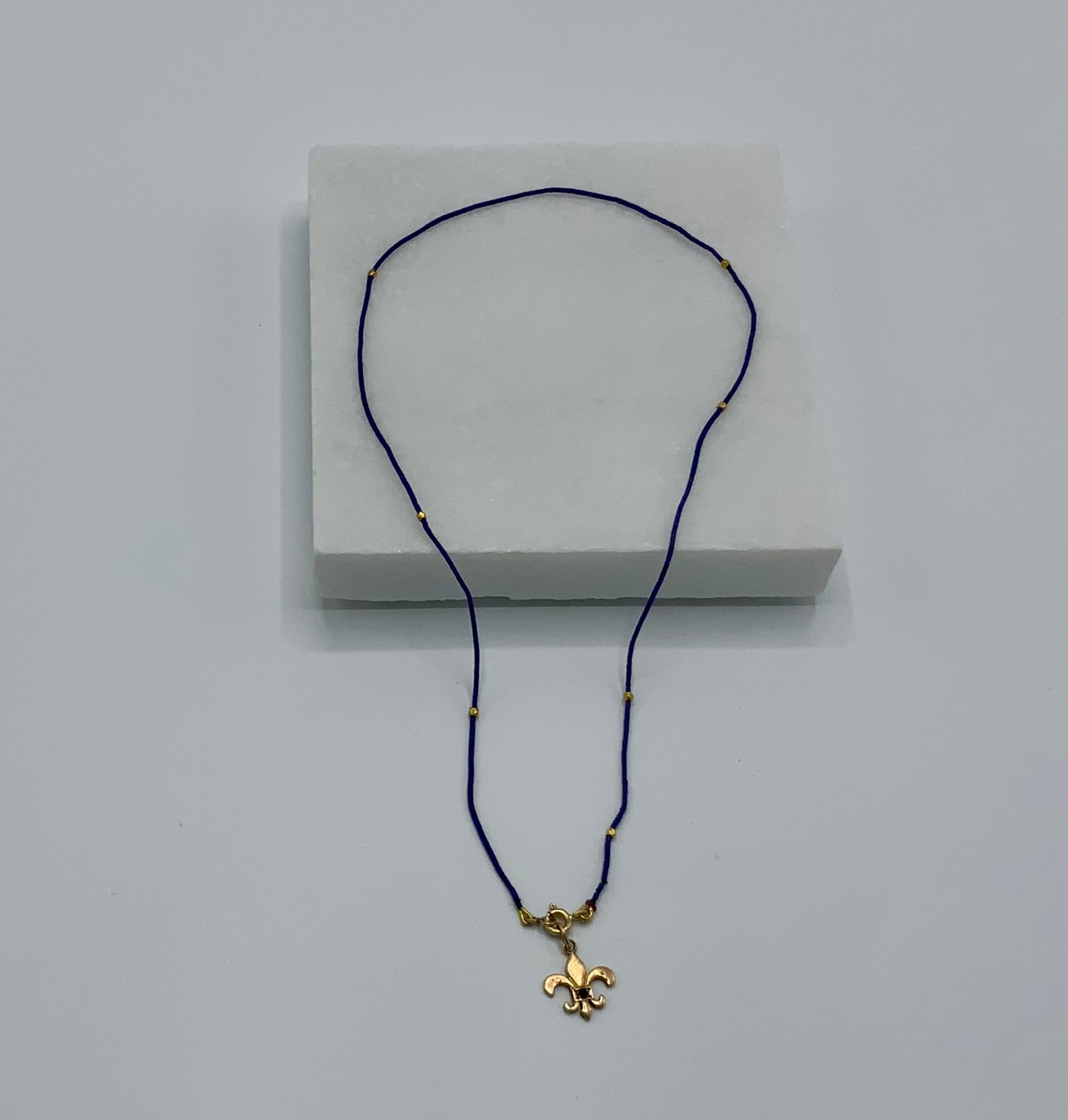 Rebecca Brenner Jewelry ~ Micro Lapis + Antique Gold Fleur de Lys Necklace
